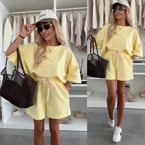 Bright yellow two-piece lounge set with relaxed T-shirt and drawstring shorts