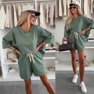 Women's sage green casual two-piece set featuring loose t-shirt and drawstring shorts