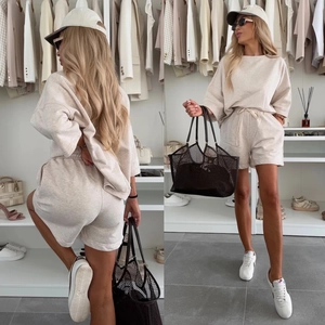 Front and back view of oatmeal knit lounge set with round neck top and drawstring shorts