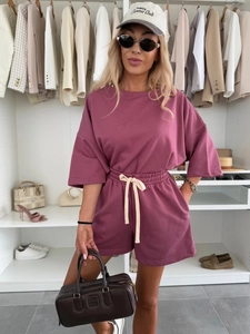 Detail of high-waisted drawstring shorts and relaxed fit T-shirt in plum purple