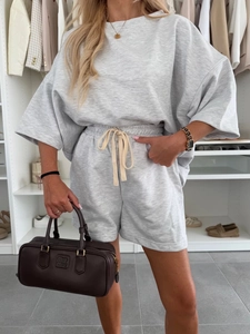 Detailed view of casual two-piece lounge set with oversized T-shirt and drawstring shorts