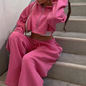 Detail of pink cropped zip-up hoodie and wide-leg sweatpants set in soft fabric