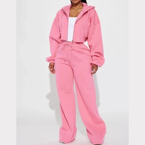 Detail of pink hooded sweatshirt and wide-leg joggers with drawstring details