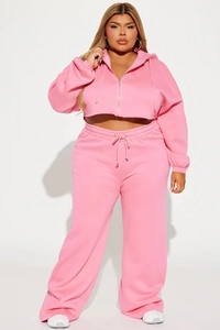 Close-up of pink zip-up hoodie set featuring premium knit fabric and metal hardware