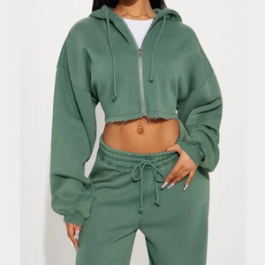 Detail of sage green cropped zip hoodie with raw hem design and drawstring jogger set