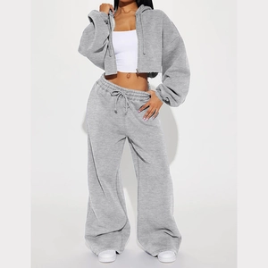 Detail of grey cropped zip hoodie and high-waist drawstring joggers in heavy fleece fabric