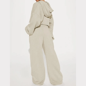 Rear view of beige cropped hoodie and high-waist wide-leg track pants leisure set
