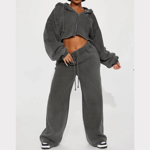Detail of high-waist wide-leg sweatpants and cropped zip hoodie in dark grey cotton