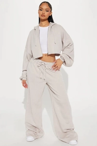 Detail of oat-colored cropped zip-up hoodie and high-waist wide-leg sweatpants set