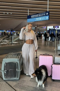 Detail of grey cropped zip-up hoodie and high-waisted wide-leg lounge pants set