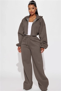 Detail of dark brown drawstring hoodie and wide-leg sweatpants set for casual wear