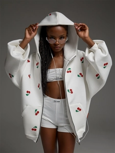 Detail of white cherry print zip-up hoodie set with ribbed crop top and matching shorts