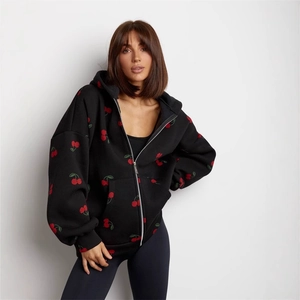 Oversized black hoodie with cherry print and zipper closure for a stylish street look