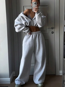 Detail of light gray two-piece set featuring cropped zip hoodie and wide-leg sweatpants
