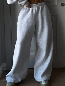 Macro detail of high-waisted light grey wide-leg lounge pants with elastic waist