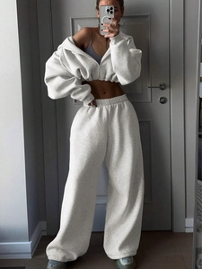 Detailed look at oatmeal two-piece tracksuit with cropped hoodie and wide-leg jogger pants