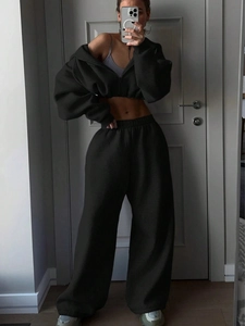 Detail view of black cropped zip hoodie and high-waist wide-leg lounge set in soft fleece