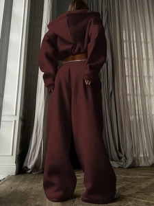 Detail of burgundy wide-leg tracksuit set with cropped hoodie from back view