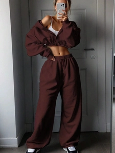 Close-up of deep brown hooded tracksuit with soft waffle texture and ribbed cuffs