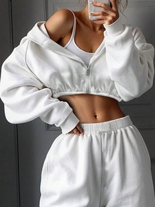 Detail of white cropped zip-up hoodie set with ribbed cuffs and high-waisted joggers