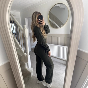 Women's dark green two-piece lounge set with zip cardigan and straight-leg pants