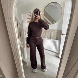 Deep brown women's casual two-piece lounge set with zip hoodie and wide leg pants