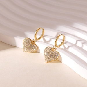 Elegant gold-tone heart drop earrings featuring micro-paved cubic zirconia and hoop closure