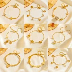 Detailed grid of nine assorted gold-plated fashion bracelets featuring heart and star charms