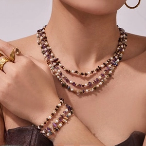 Three-layer beaded necklace and bracelet set with pearls, amethyst and gold spacers