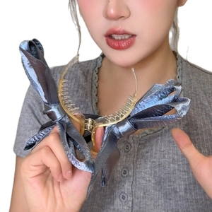 Three-layer silk bow banana clip in pearlized blue-grey for elegant high ponytail styling
