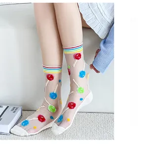 Detail of sheer tulip-style socks with colorful lollipop prints and rainbow striped cuffs