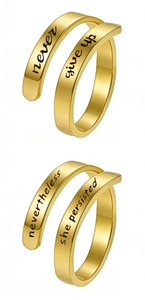 Detail of gold open rings featuring engraved inspirational quotes and polished finish