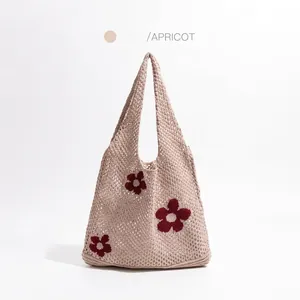 Apricot knit tote bag with red floral pattern in a hollow-out crochet mesh design
