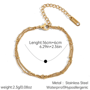 Detail of 18k gold double layer stainless steel bracelet with bead charms and extender