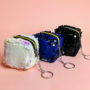 Glitter sequin coin purses in white, blue, and black with secure metal keyrings