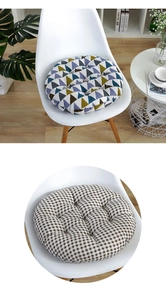 Detail of round cotton seat cushions featuring geometric and plaid patterns on chairs