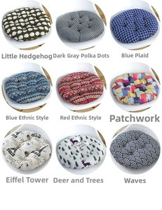 Detail view of nine patterned round chair cushions with quilted surface and diverse prints