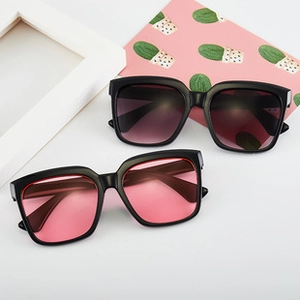 Top view of square oversized sunglasses with purple and pink lenses on white background
