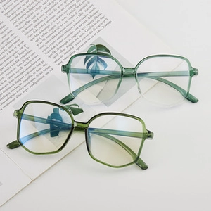Detail view of transparent green oversized polygon frames with lightweight resin finish