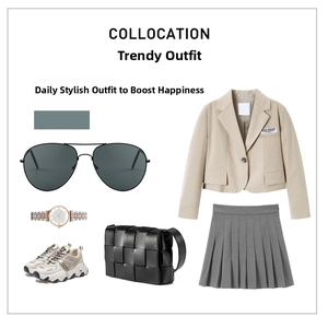 Flat lay of oversized metal aviator sunglasses with a beige blazer and pleated skirt