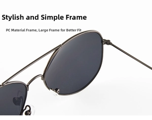 Detailed macro view of the durable PC frame hinge on metal pilot sunglasses