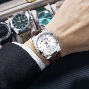 Close-up of MSTIANQ men's watch with white dial, day-date display and brown leather strap