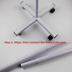 Installation step of rotating display stand connecting white metal base with swivel wheels