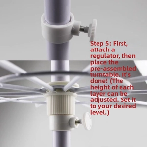 Detail of adjustable height knob and tiered metal wire tray on white rotating stand