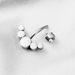 Surgical steel navel ring with five circular discs and a clear zircon stone screw cap