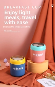 Detail of insulated breakfast cups showing foldable spoon storage and matte texture