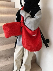 Vibrant red plush tote bag and matching clutch set in soft faux fur for women