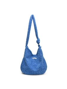 Vibrant blue plush faux fur tote bag with a soft texture and spacious shoulder strap