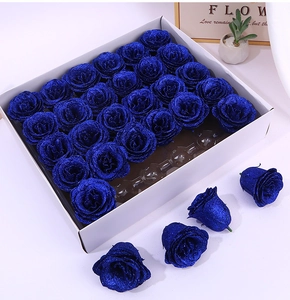 Detailed view of 25-piece dark blue glitter artificial rose heads in a gift box