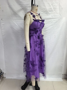 Detail of purple tulle dress showing 3D butterfly embroidery and delicate straps